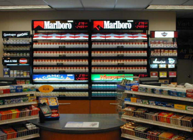 modular metal cigarette fixtures installed behind c-store counter